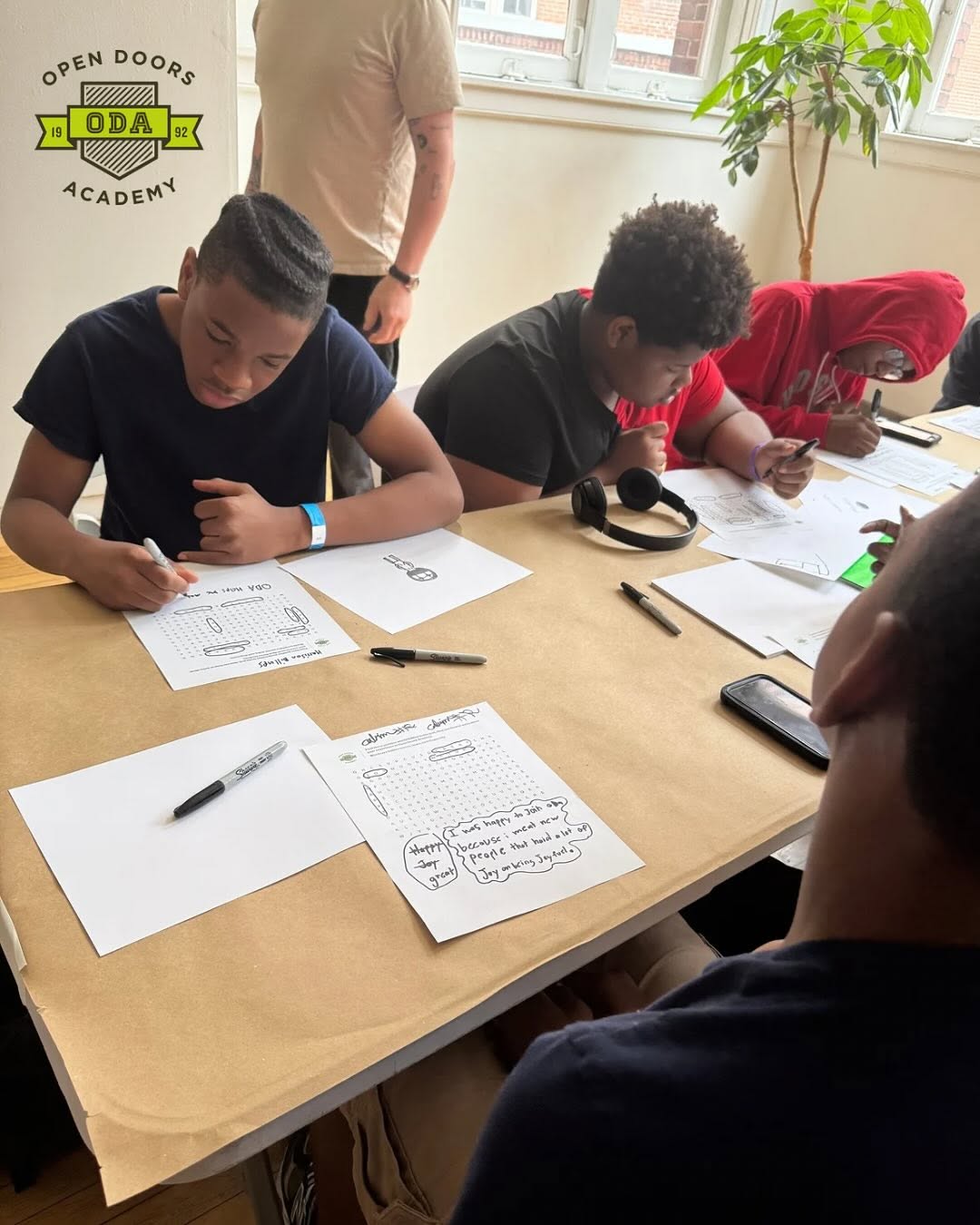 Last week, middle school scholars in “The Future We Build” camp kicked off their week with a chance to reflect on what matters most.

Scholars jumped into a word search with words like happy, joy, great, and mature, and then used what they found to write about how ODA makes them feel.

“I was happy to join ODA because I meet new people that have a lot of joy,” shared Calvin.

Next up: a group brainstorm on what makes them happy. Sticky notes filled the walls of the @thelittlejacket office, with written answers ranging from “my mom,” “animals,” “chocolate,” “field trips,” “God,” and “LeBron.”

Huge thanks to Little Jacket for helping us start the week off strong and @trgmultimedia for capturing moments like this!